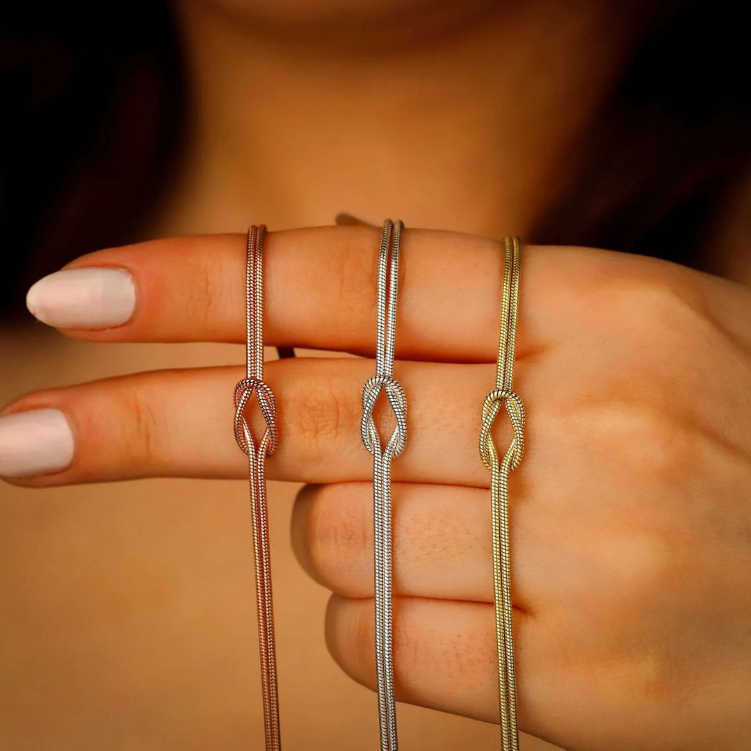 Eternal Knot Armband - Unterstütze Brustkrebs (1+1 GRATIS)